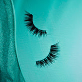 A floating lash shot of Salon Perfect Siren Eyes 653 lash out of packaging